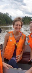 Staff member Kate wearing a lifejacket on a boat.